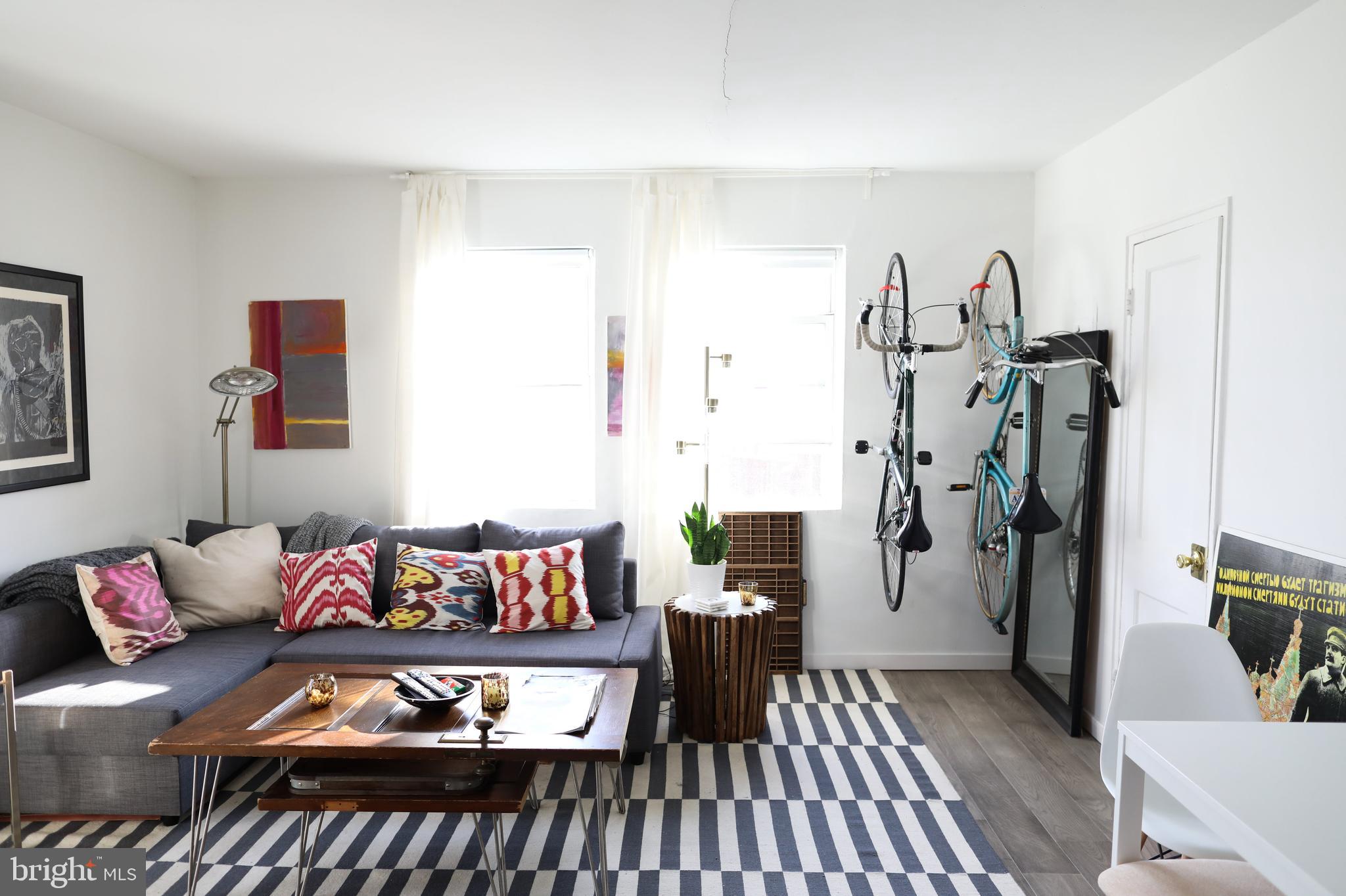 1520-1524 Queen Street Northeast Washington, DC 20002 - Photo 4 of 19 a living room with furniture and a couch