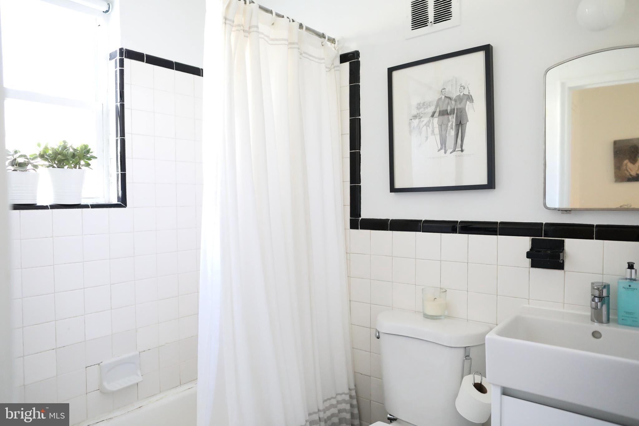 1520-1524 Queen Street Northeast Washington, DC 20002 - Photo 8 of 19 a bathroom with a toilet sink and tub