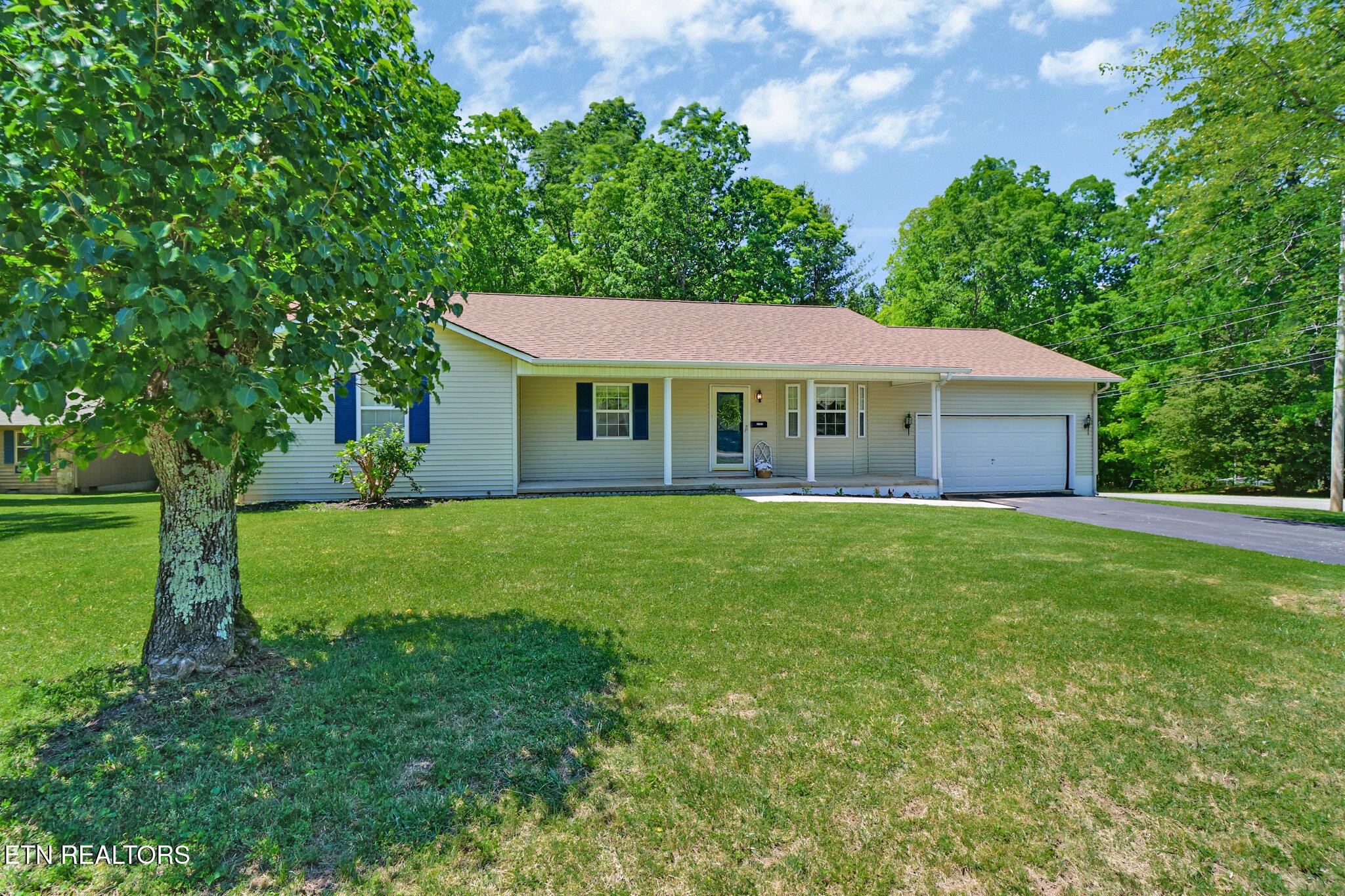 2162 Spruce Loop Crossville, TN 38555 - Photo 1 of 25 a front view of a house with a garden