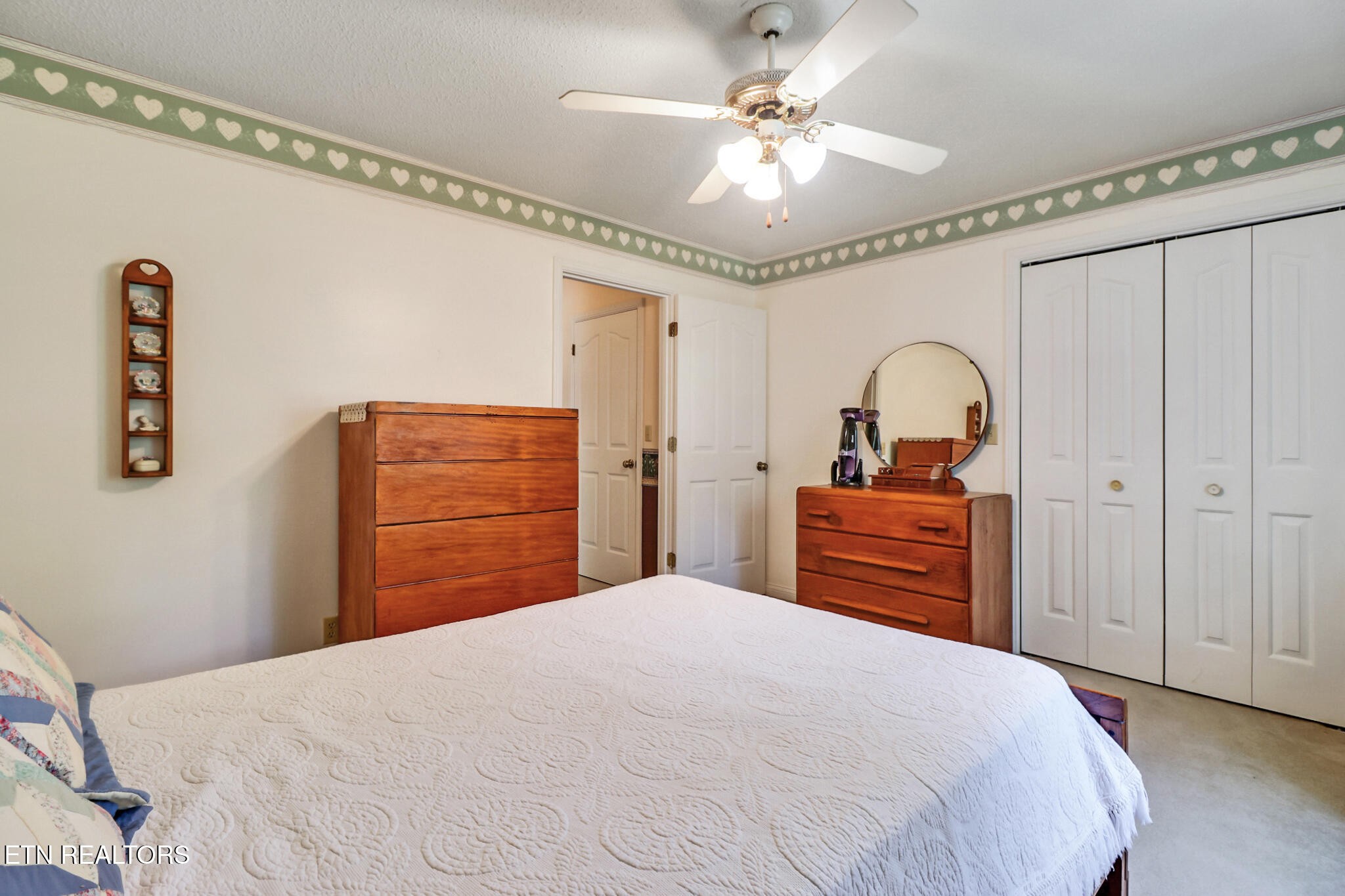 2162 Spruce Loop Crossville, TN 38555 - Photo 15 of 25 a bedroom with a bed and a chandelier