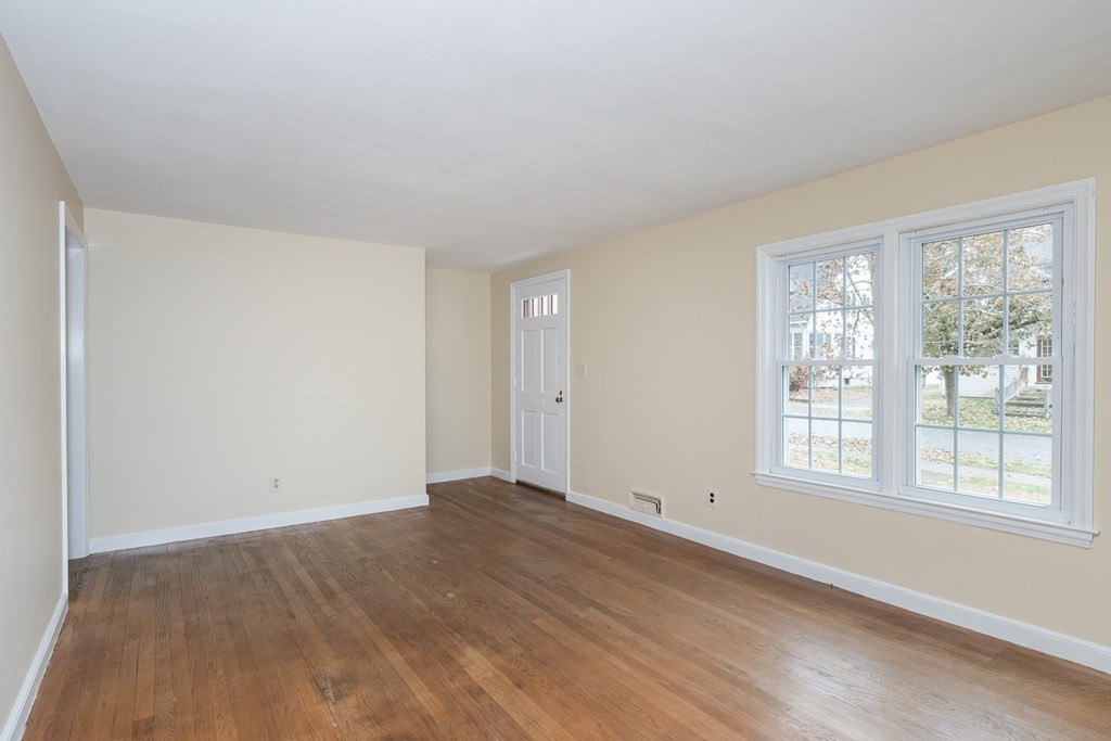 136 Lincoln Road Longmeadow, MA 01106 - Photo 23 of 40 a view of an empty room with wooden floor and a window