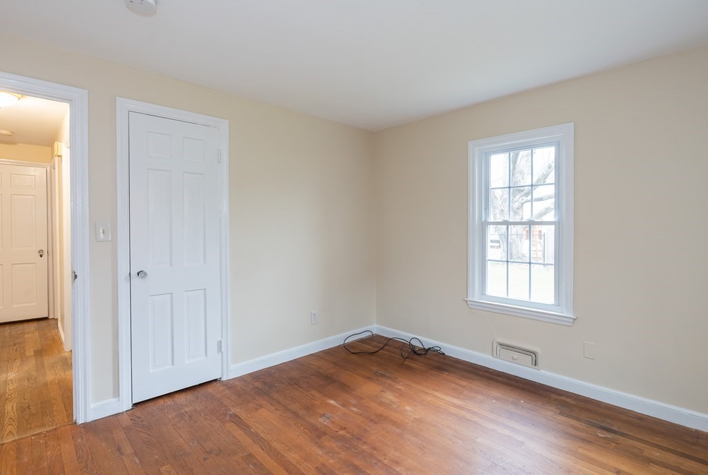 136 Lincoln Road Longmeadow, MA 01106 - Photo 30 of 40 an empty room with wooden floor and windows