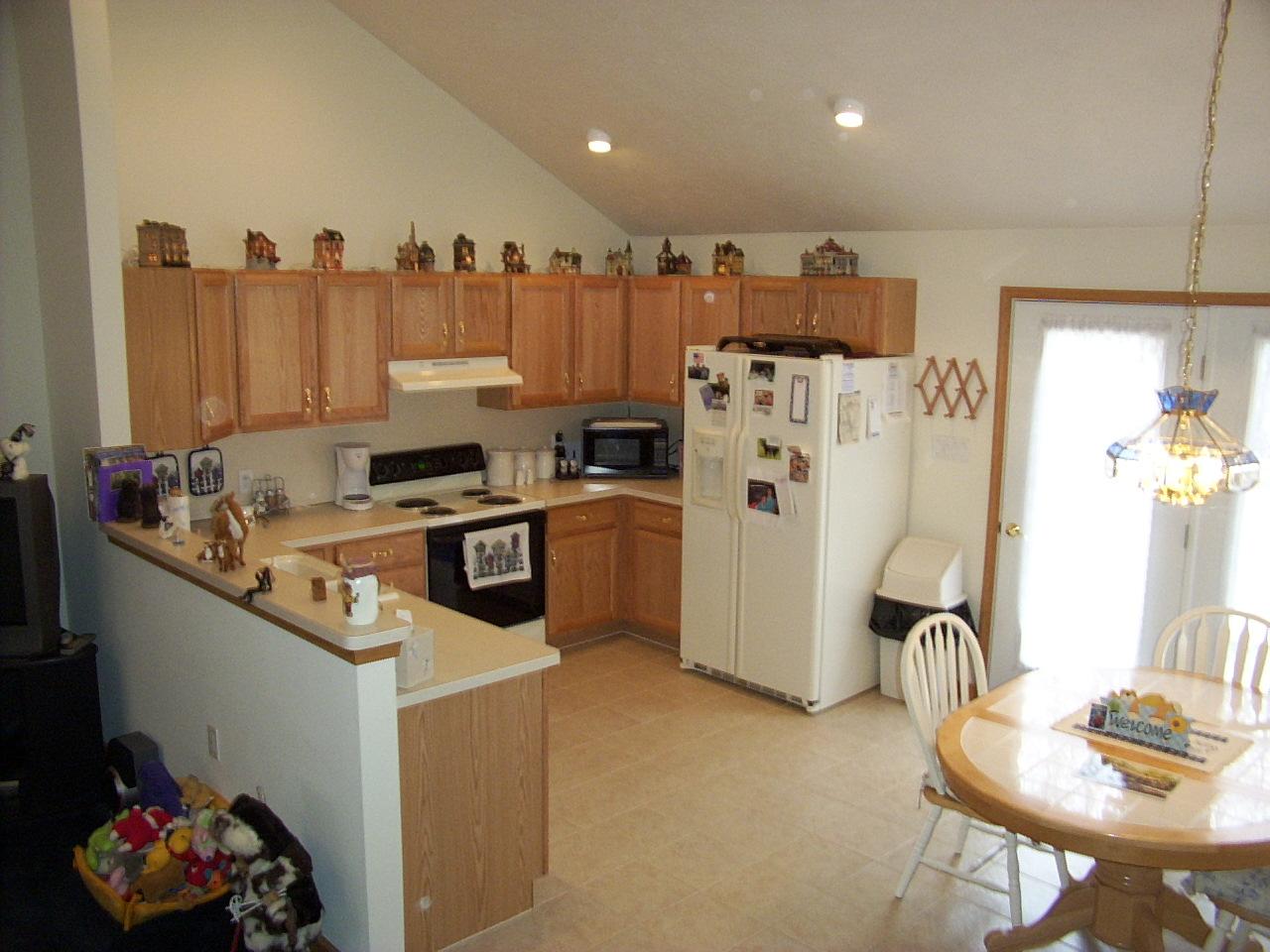 14 Fern Ridge Road Blakeslee, PA 18610 - Photo 3 of 6 a kitchen with refrigerator and cabinets