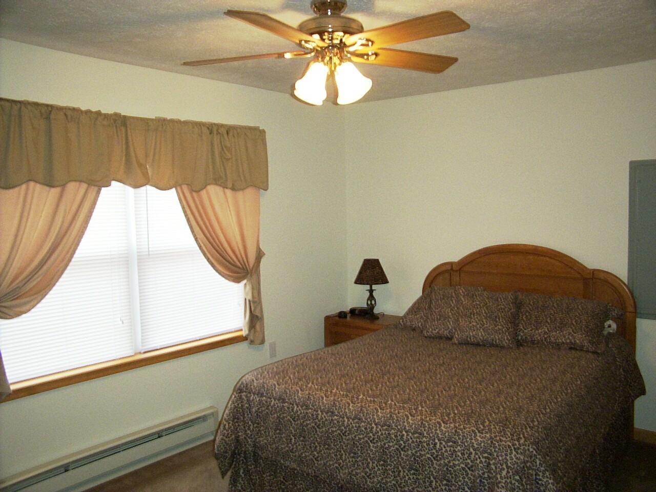 14 Fern Ridge Road Blakeslee, PA 18610 - Photo 6 of 6 a bedroom with a bed and a window