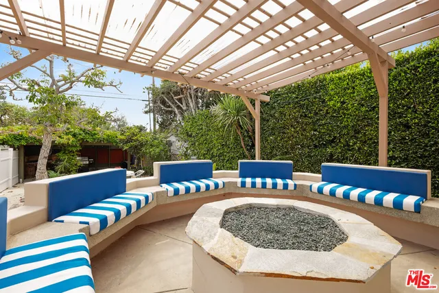 a view of a patio with couches chairs and a table