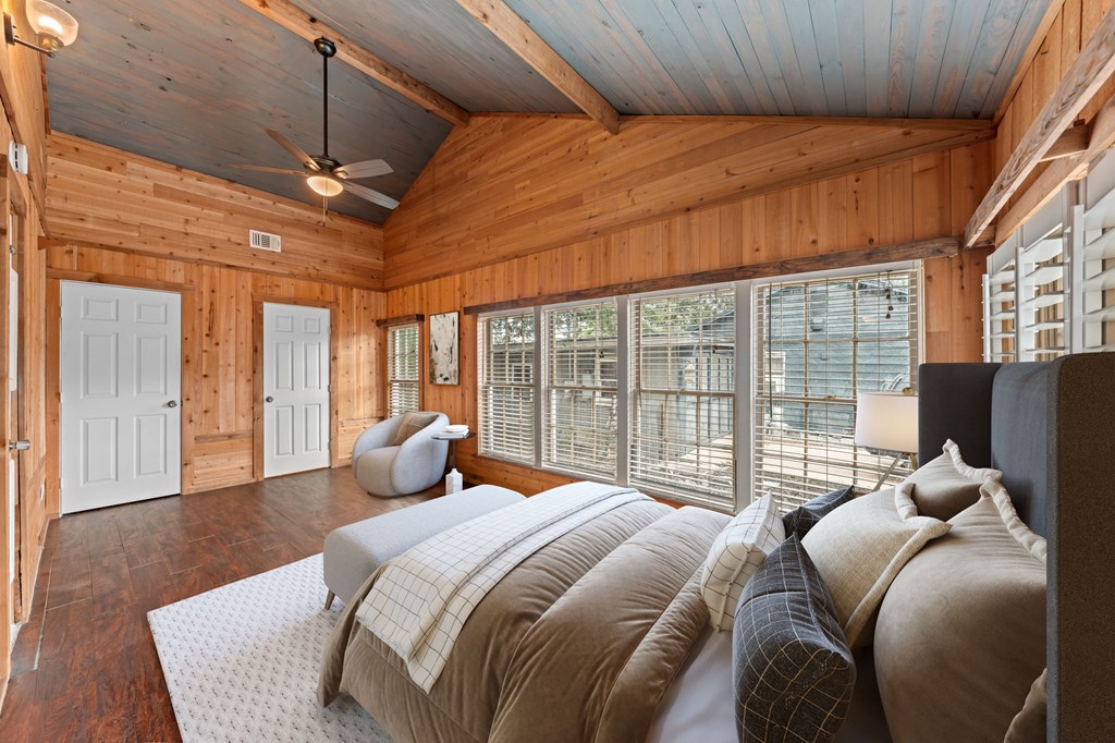 616 Lois Street Kerrville, TX 78028 - Photo 14 of 32 a bedroom with a bed and glass door