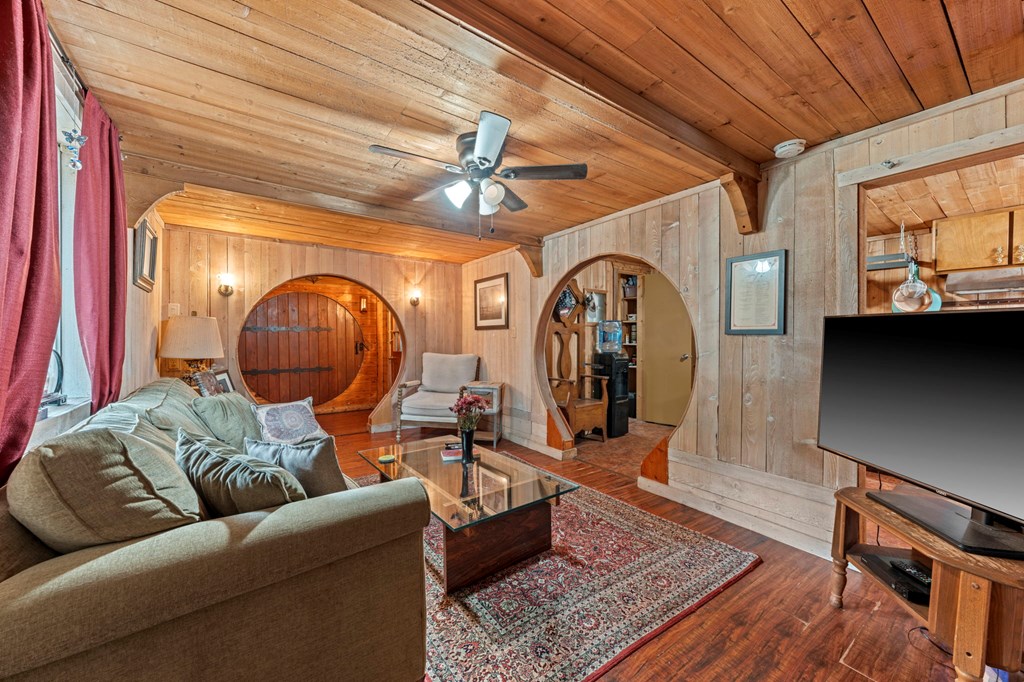616 Lois Street Kerrville, TX 78028 - Photo 23 of 32 a living room with furniture a rug and a chandelier