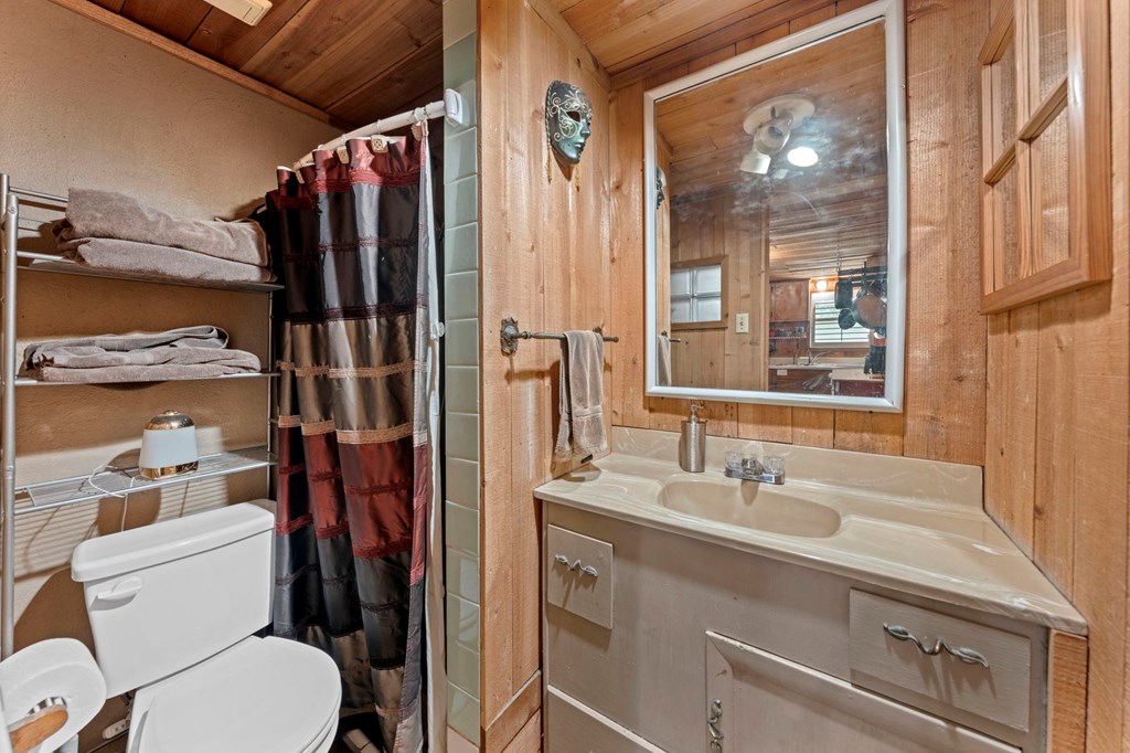 616 Lois Street Kerrville, TX 78028 - Photo 29 of 32 a bathroom with a sink toilet and shower