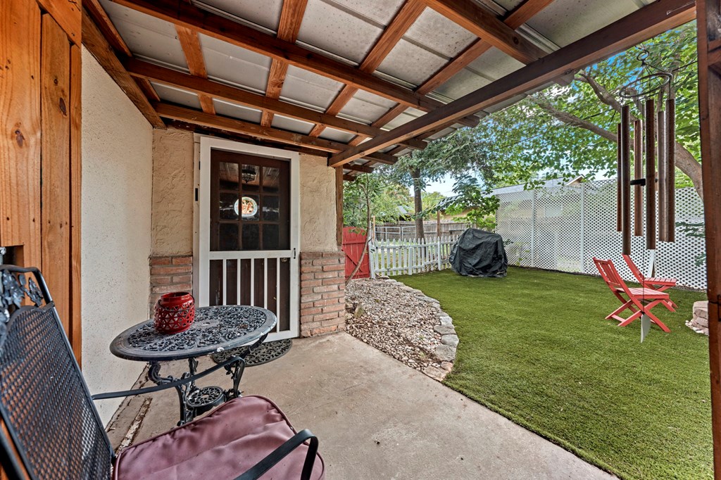 616 Lois Street Kerrville, TX 78028 - Photo 30 of 32 a backyard of a house with table and chairs