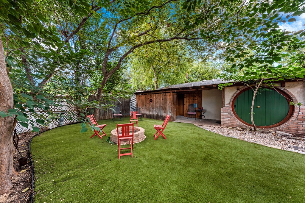 616 Lois Street Kerrville, TX 78028 - Photo 31 of 32 a backyard of a house with seating space