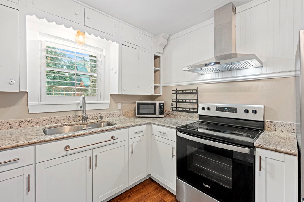 616 Lois Street Kerrville, TX 78028 - Photo 10 of 32 a kitchen with cabinets appliances and a sink