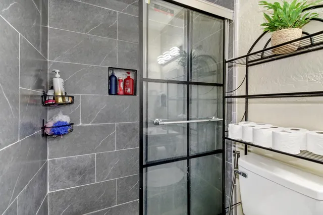 a room with a refrigerator and washer