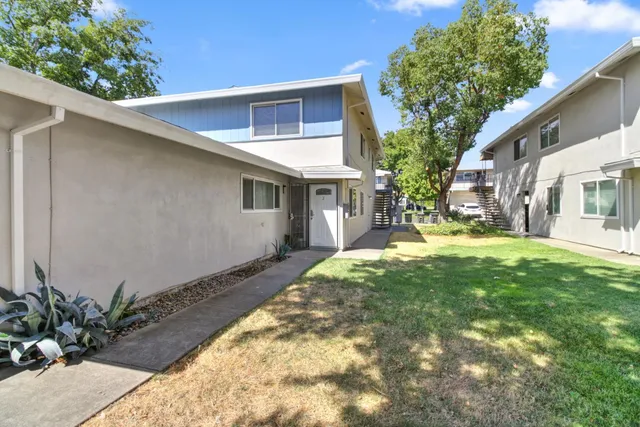 a view of a house with a yard