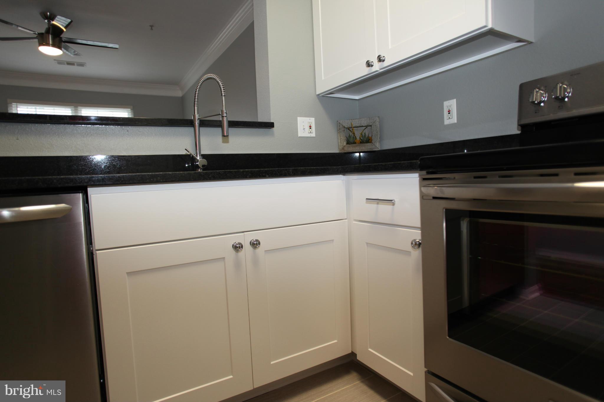 1521 Spring Gate Dr., Unit 10202 McLean, VA 22102 - Photo 14 of 30 Kitchen with new white cabinets