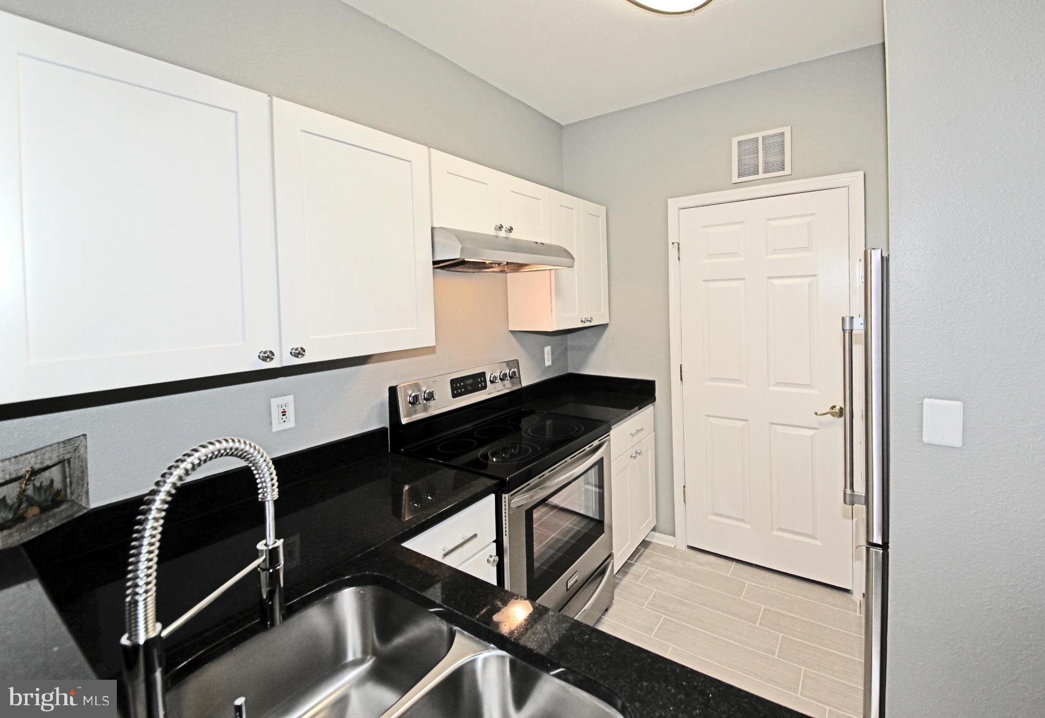 1521 Spring Gate Dr., Unit 10202 McLean, VA 22102 - Photo 16 of 30 New black granite countertops