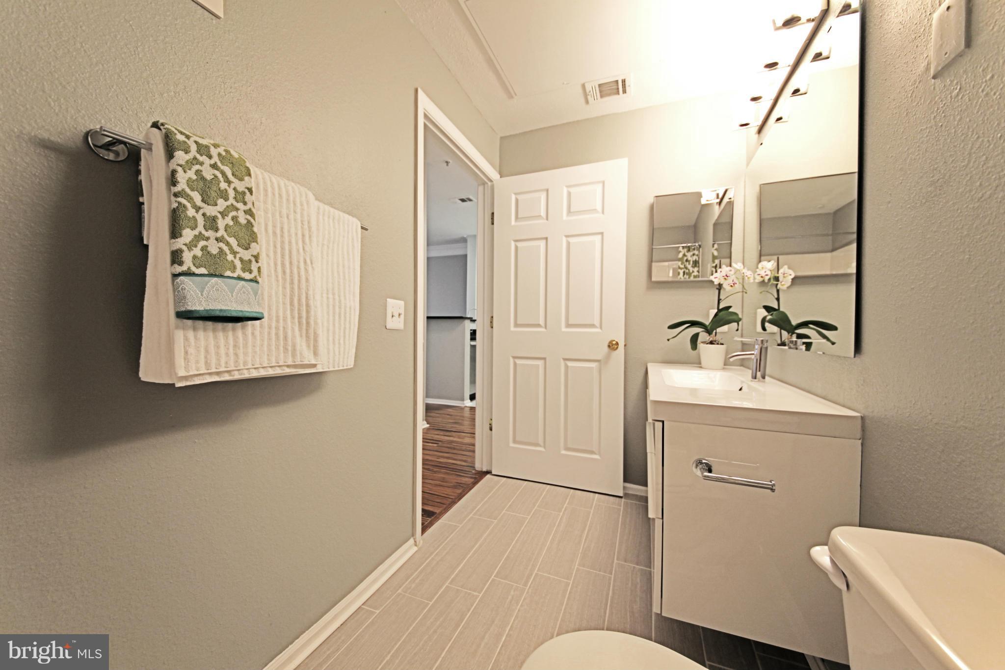 1521 Spring Gate Dr., Unit 10202 McLean, VA 22102 - Photo 9 of 30 Plank style tile floors in bathroom