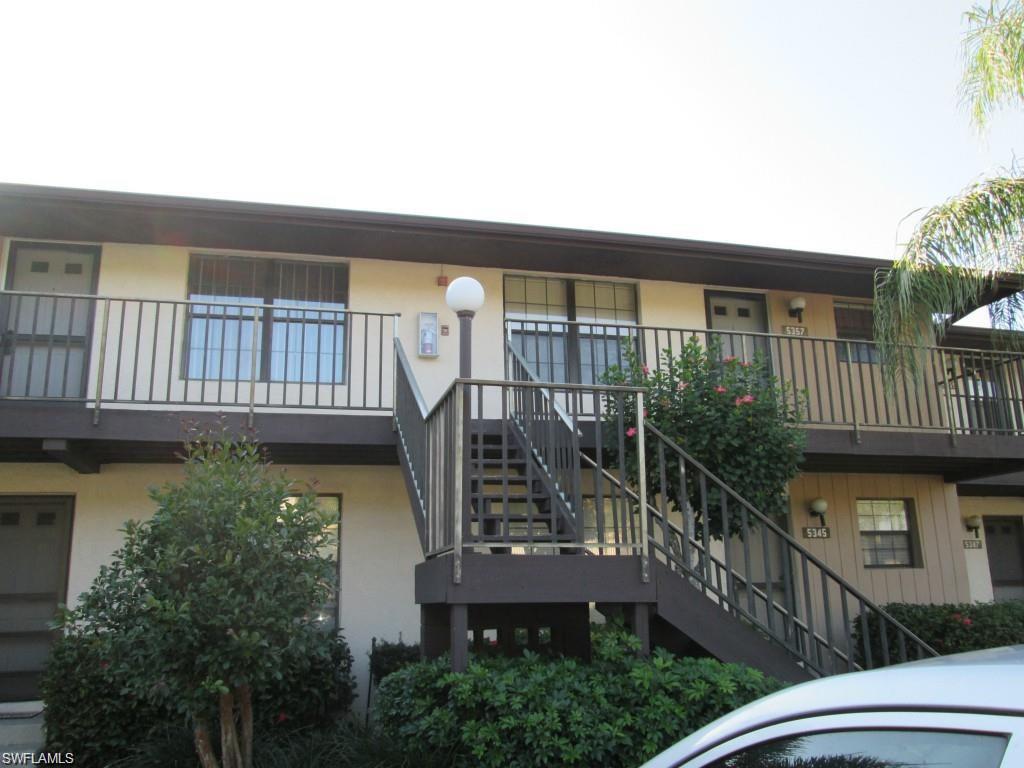 5355 Treetops Drive, Unit S201 Naples, FL 34113 - Photo 1 of 7 a balcony view with a garden space