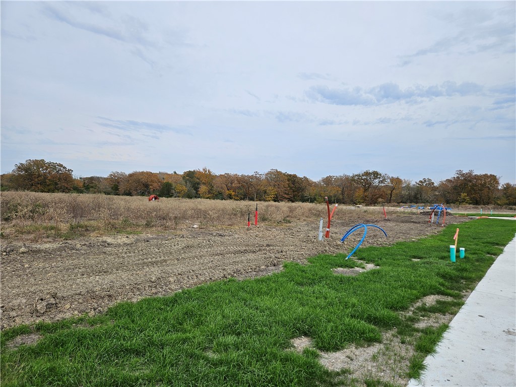 a view of a lake with houses in the back