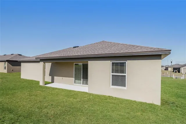 a house that has garden in front of it