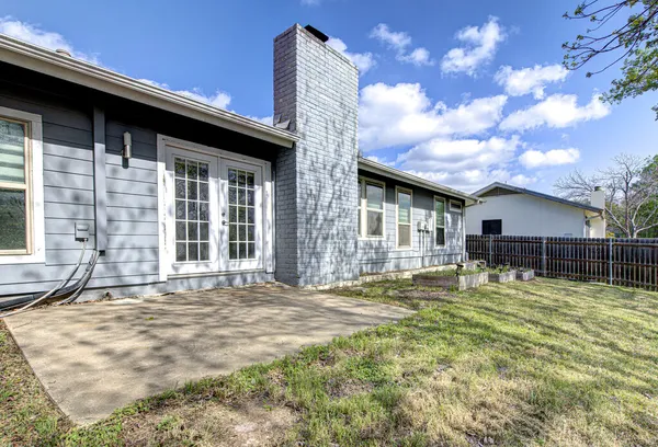 a house view with a backyard space