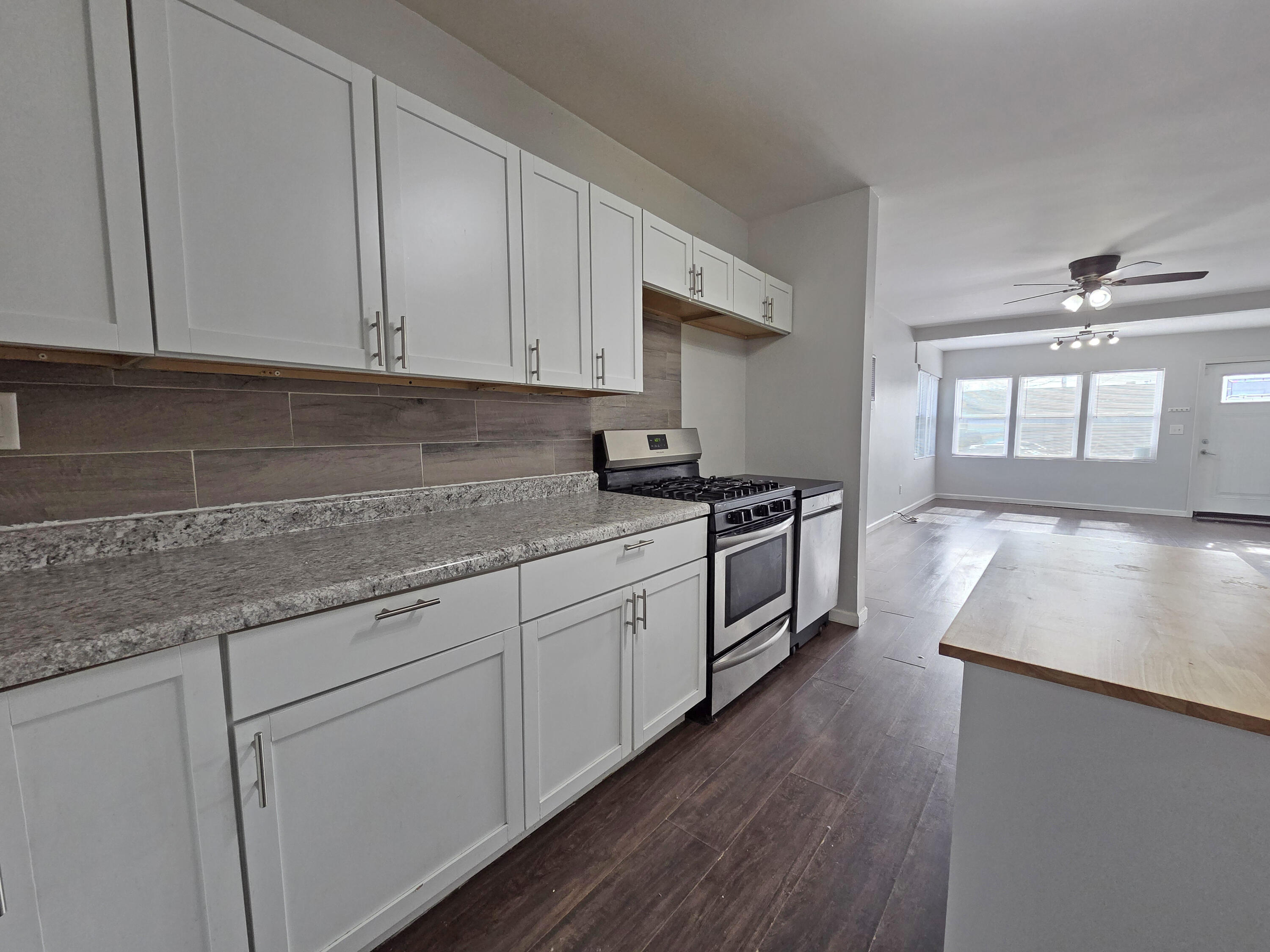 1127 164th Place Hammond, IN 46320 - Photo 15 of 34 a kitchen with granite countertop white cabinets and white appliances