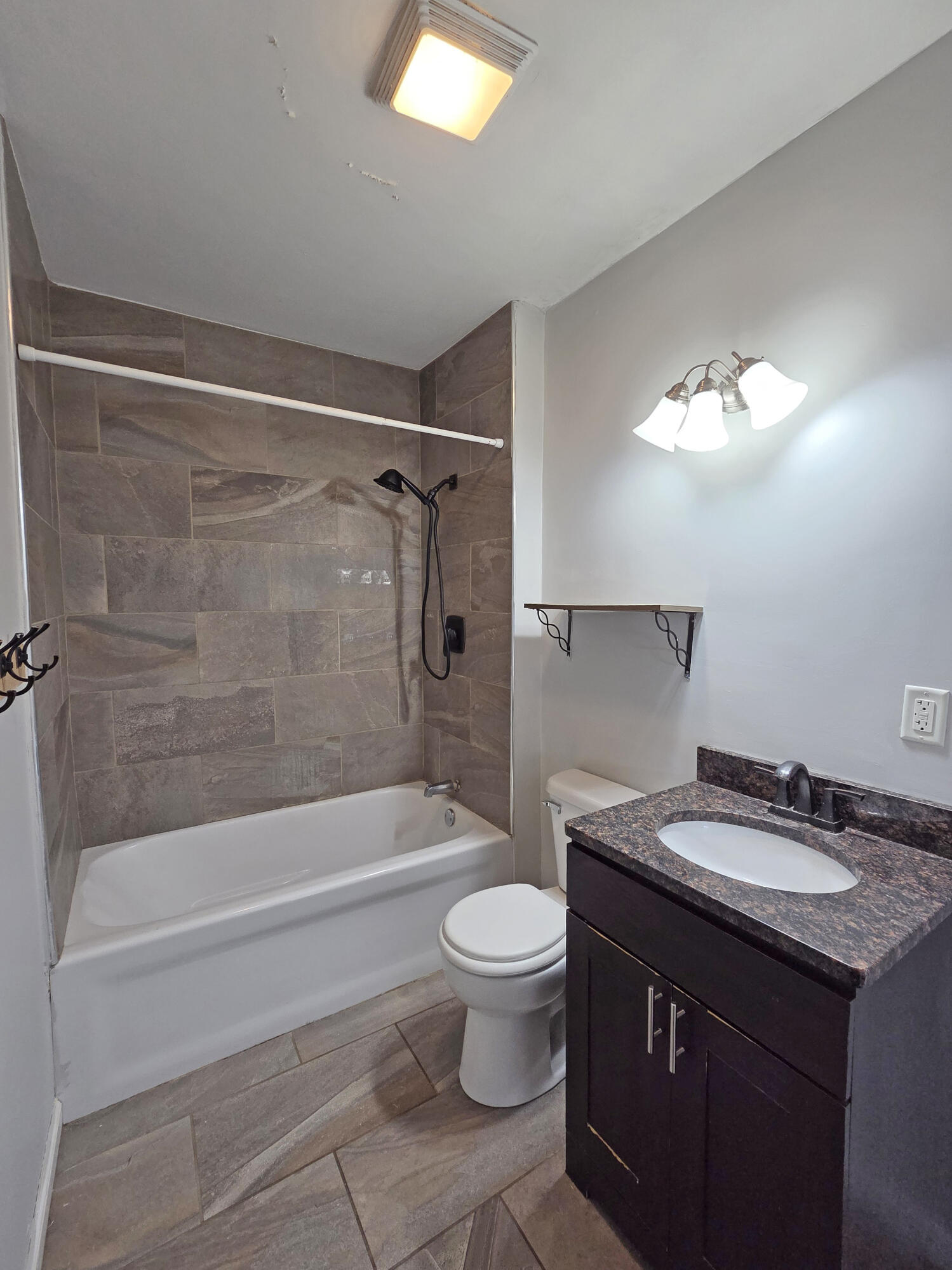 1127 164th Place Hammond, IN 46320 - Photo 22 of 34 a bathroom with a sink a toilet and a bathtub