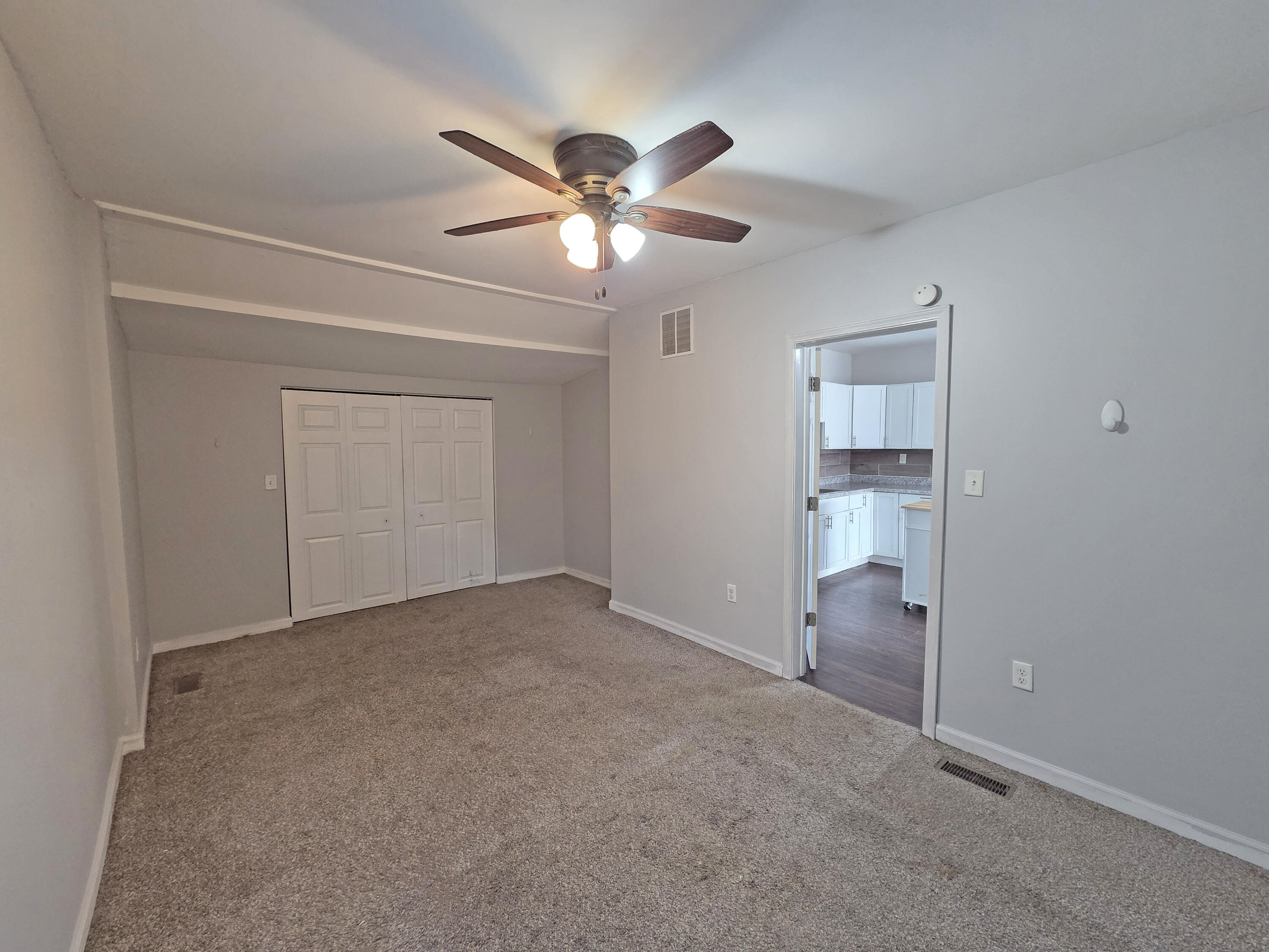1127 164th Place Hammond, IN 46320 - Photo 23 of 34 a view of an empty room and a chandelier fan