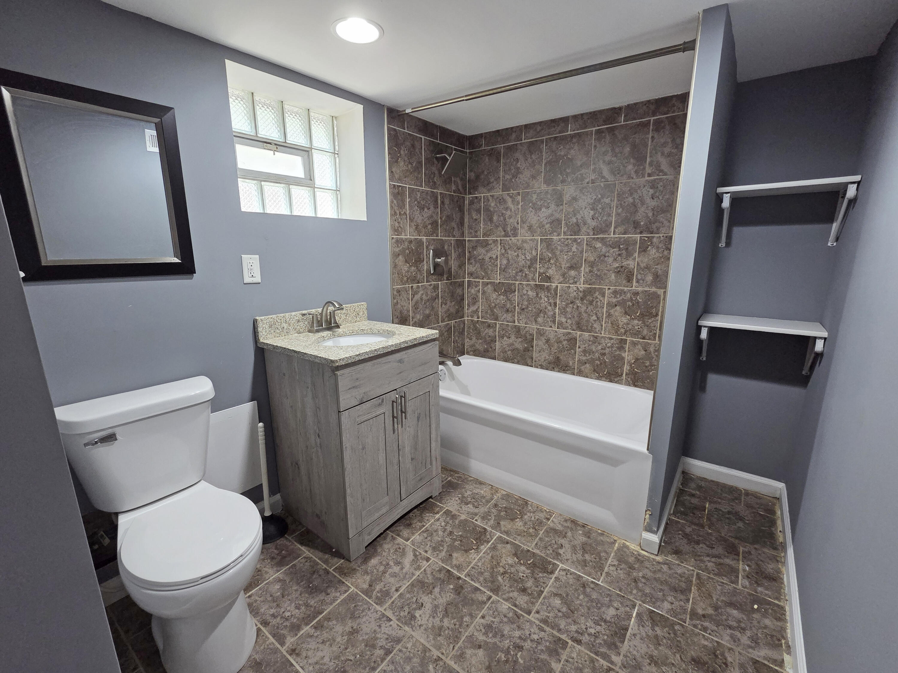 1127 164th Place Hammond, IN 46320 - Photo 30 of 34 a bathroom with a sink toilet and shower