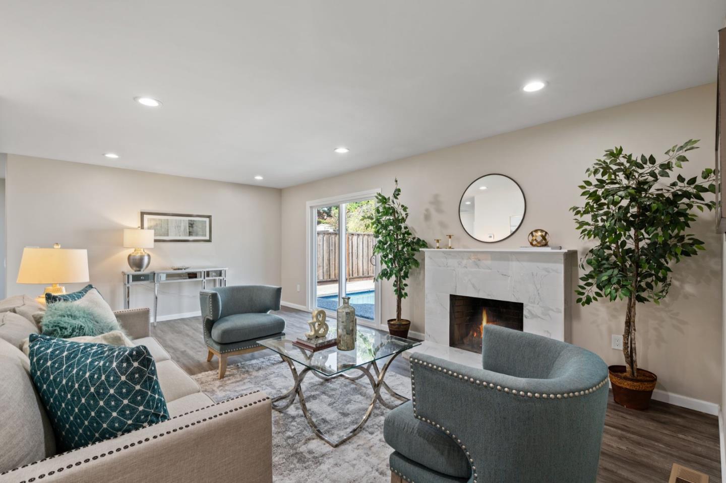 2178 Corktree Lane San Jose, CA 95132 - Photo 13 of 41 a living room with furniture a window and a fireplace