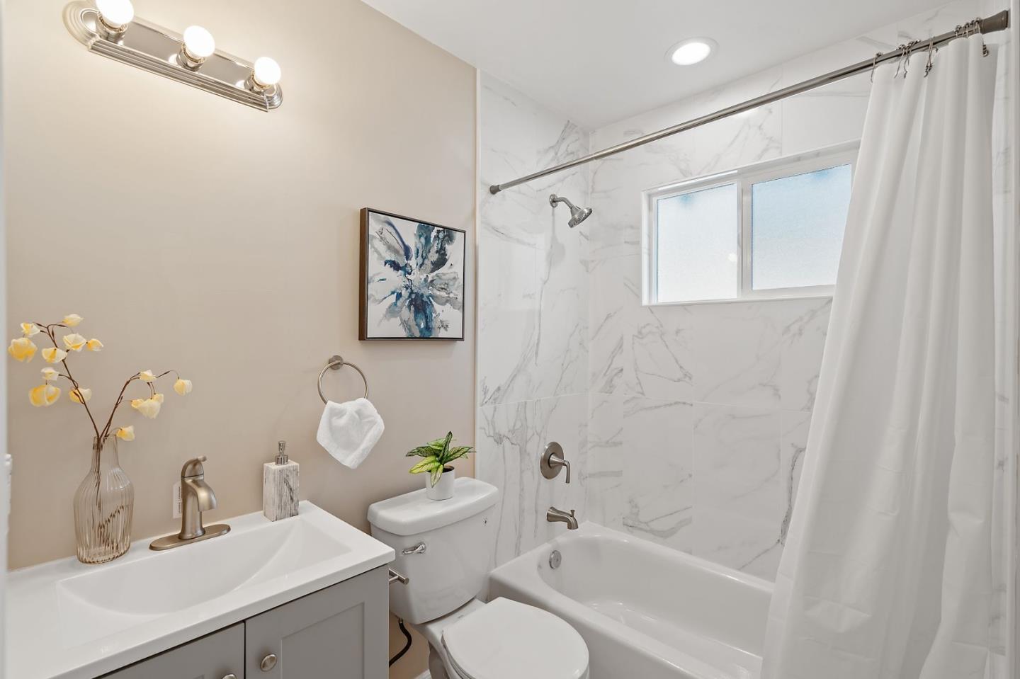 2178 Corktree Lane San Jose, CA 95132 - Photo 16 of 41 a bathroom with a sink mirror vanity and toilet