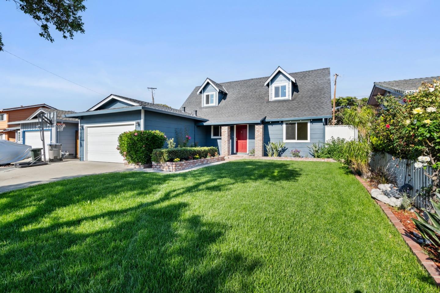 2178 Corktree Lane San Jose, CA 95132 - Photo 3 of 41 a front view of a house with a yard and potted plants