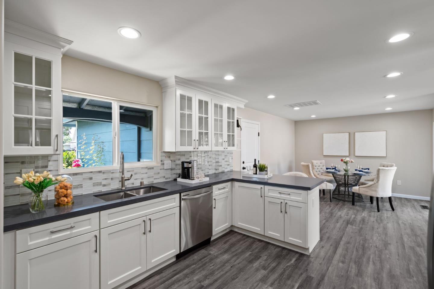 2178 Corktree Lane San Jose, CA 95132 - Photo 5 of 41 a kitchen with lots of counter top space and wooden floor