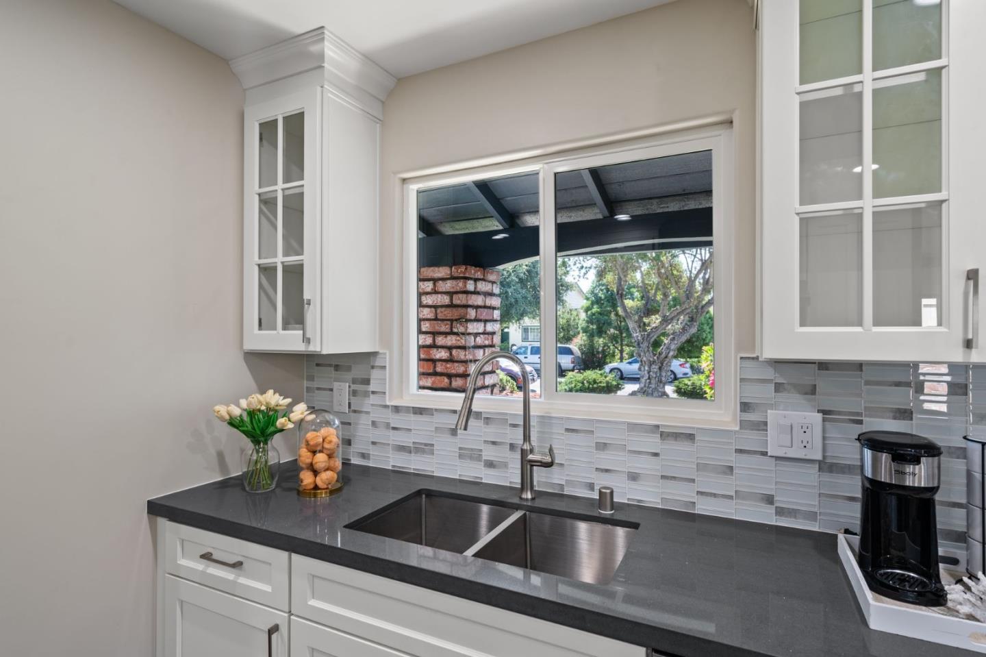 2178 Corktree Lane San Jose, CA 95132 - Photo 10 of 41 a kitchen with granite countertop a sink and a window