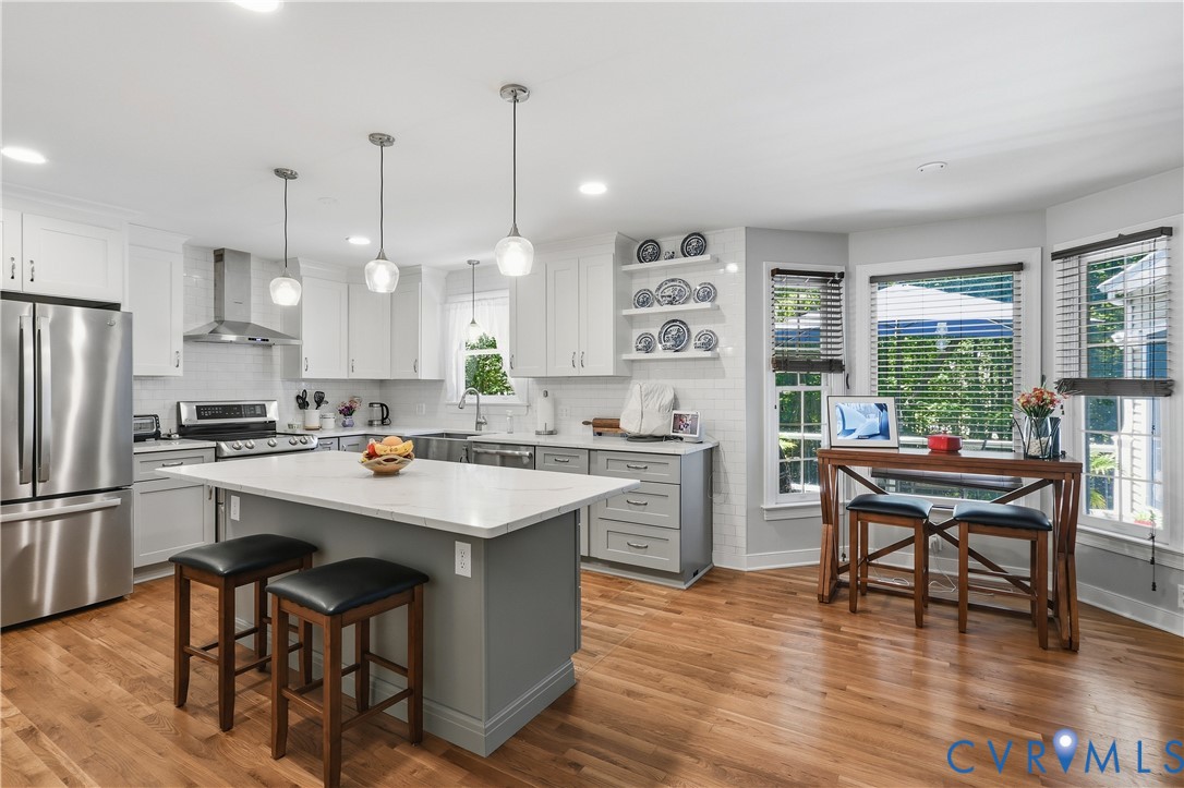 12512 2nd Branch Road Chesterfield, VA 23838 - Photo 12 of 56 a kitchen with stainless steel appliances a dining table chairs refrigerator and sink