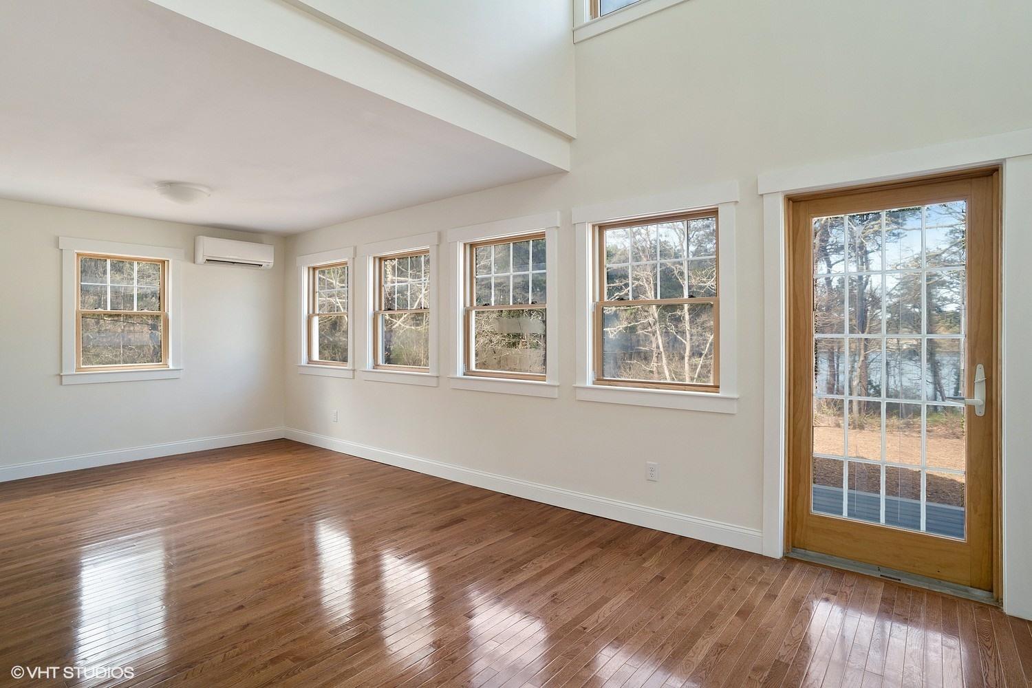 78 Stillwater Road Chatham, MA 02633 - Photo 4 of 18 a view of an empty room with wooden floor and windows