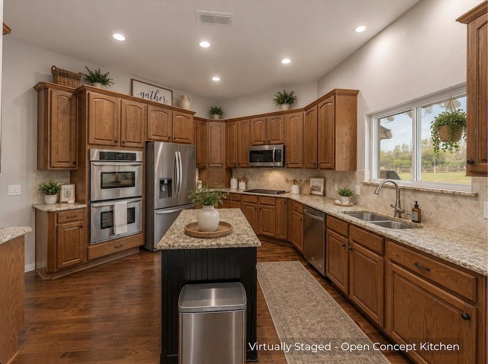 15 Trail Ridge Drive Melissa, TX 75454 - Photo 15 of 38 a kitchen with kitchen island granite countertop stainless steel appliances cabinets a sink and a counter space