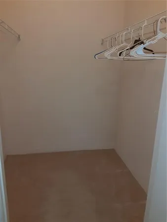 a white toilet sitting next to a bath tub