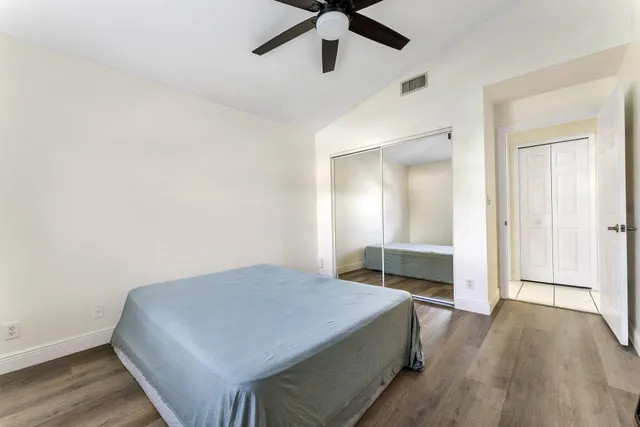 a bedroom with a bed and a table in it