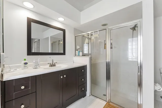 a bathroom with a double vanity sink mirror and