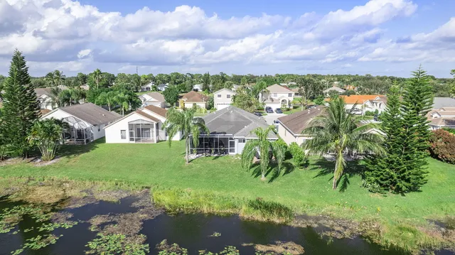 a view of a garden with a building in the background