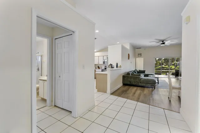 a view of a living room kitchen and a sink