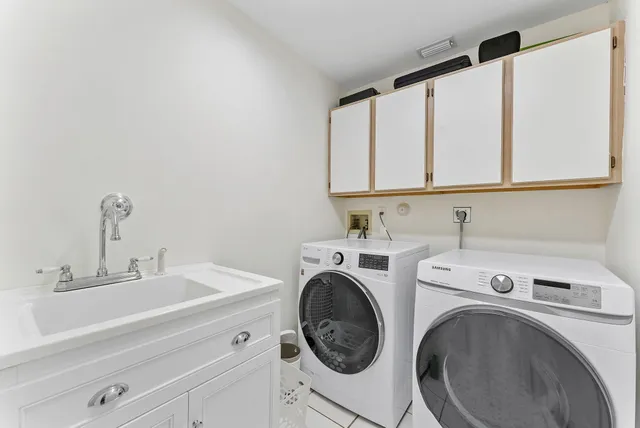 a utility room with dryer and washer