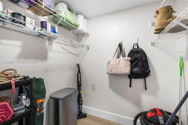 a view of storage and utility room with toys and stairs