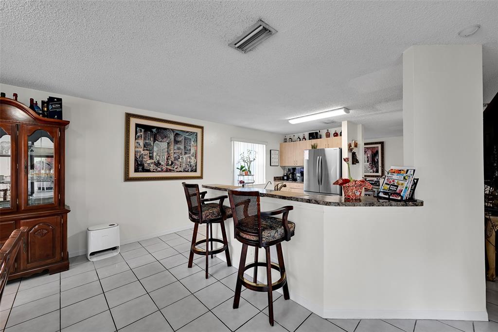 17332 Southwest 18th Street Miramar, FL 33029 - Photo 14 of 43 a view of a dining room kitchen and a window