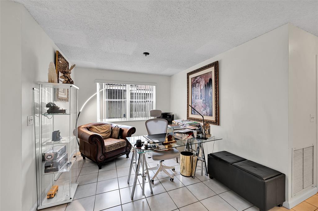 17332 Southwest 18th Street Miramar, FL 33029 - Photo 19 of 43 a living room with furniture and a window