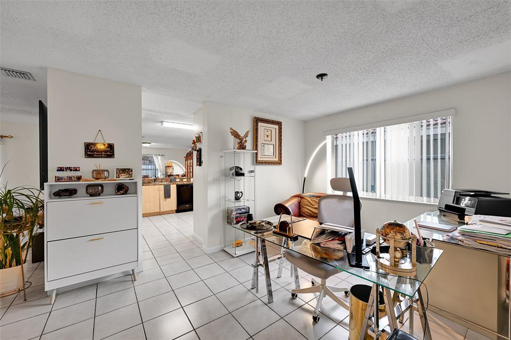 17332 Southwest 18th Street Miramar, FL 33029 - Photo 20 of 43 a living room with furniture and a window