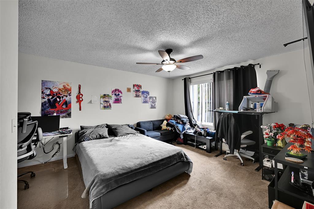 17332 Southwest 18th Street Miramar, FL 33029 - Photo 29 of 43 a bedroom with furniture a chandelier and a window