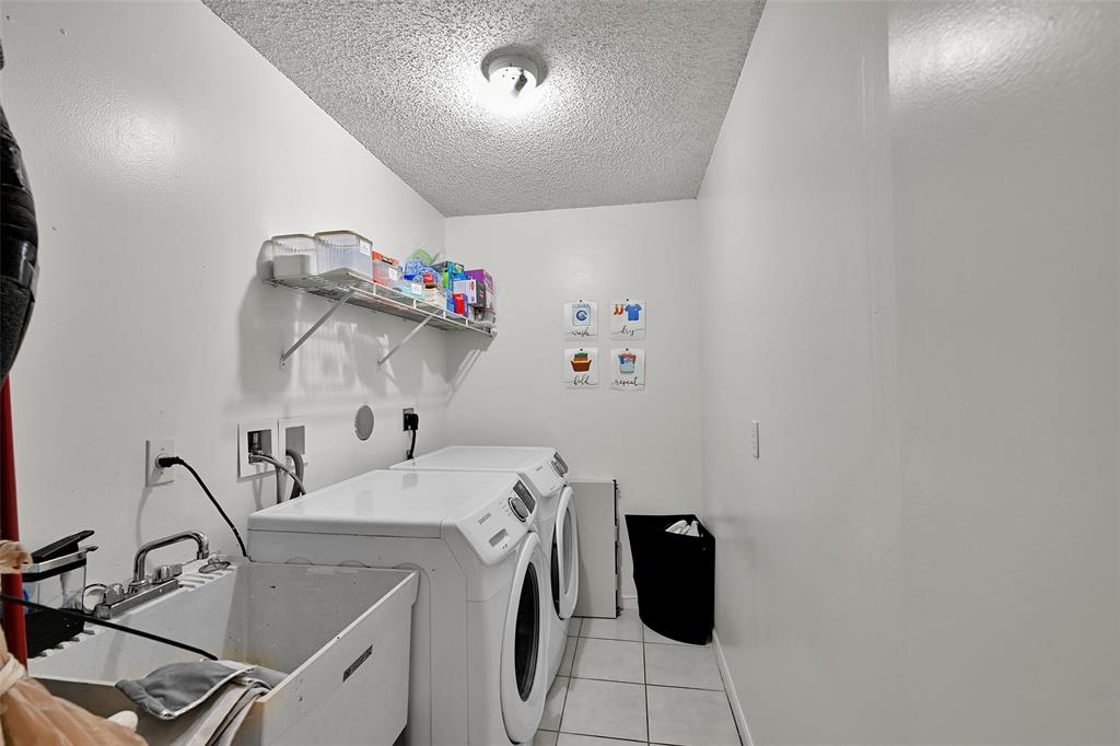 17332 Southwest 18th Street Miramar, FL 33029 - Photo 41 of 43 a room with a washing machine
