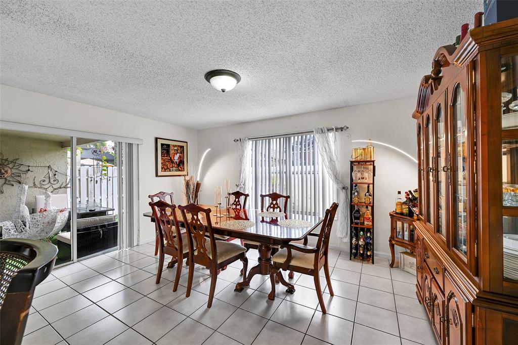 17332 Southwest 18th Street Miramar, FL 33029 - Photo 9 of 43 a view of a dining room with furniture and window