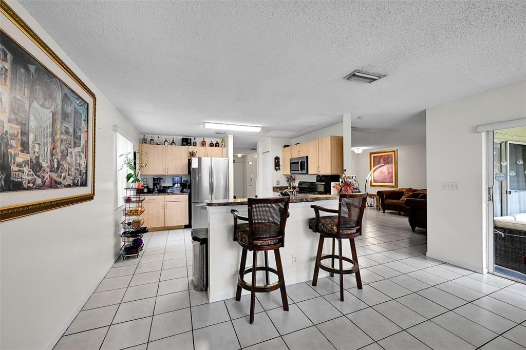 17332 Southwest 18th Street Miramar, FL 33029 - Photo 10 of 43 a view of a dining room with furniture
